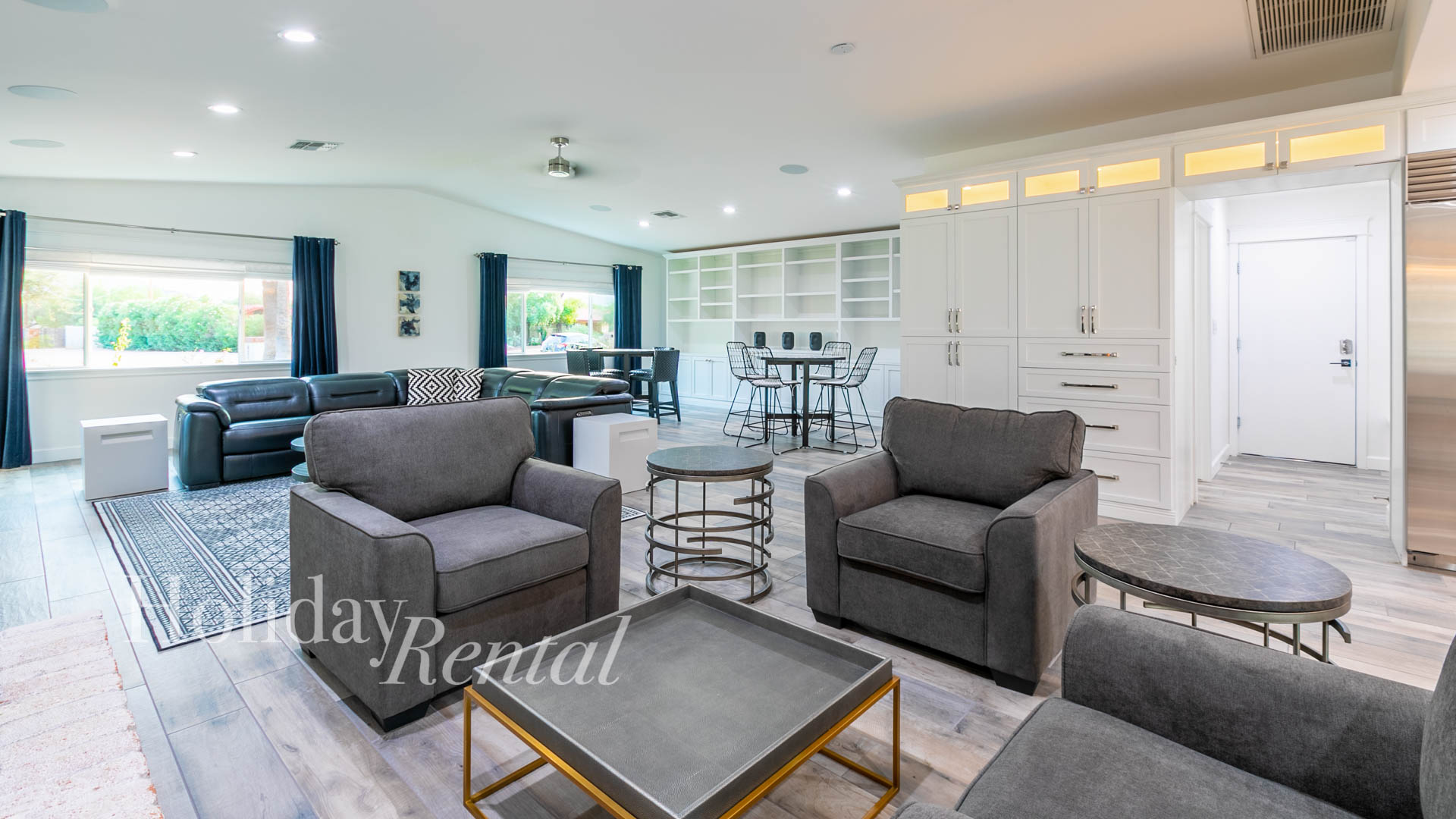 Sinking into luxurious comfort in the grand living room, featuring ample seating for all to relax in style