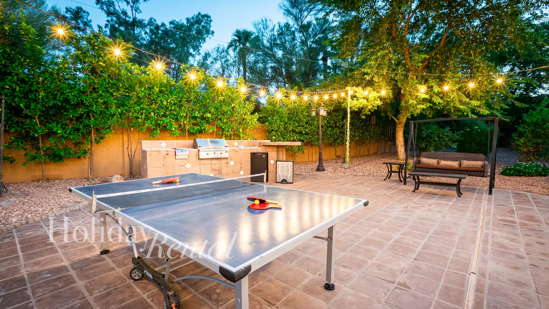 The patio grill and outdoor ping pong table are just some of the many outdoor amenities