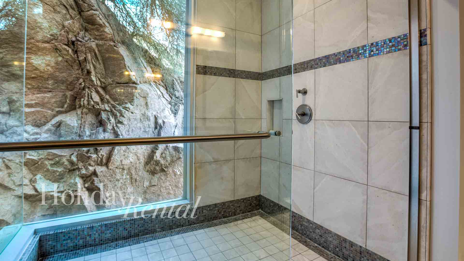 Full Bathroom with shower in the rocks