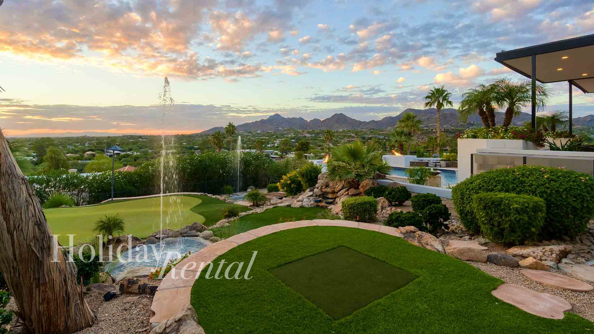 This resort-style property features multiple putting greens and water features