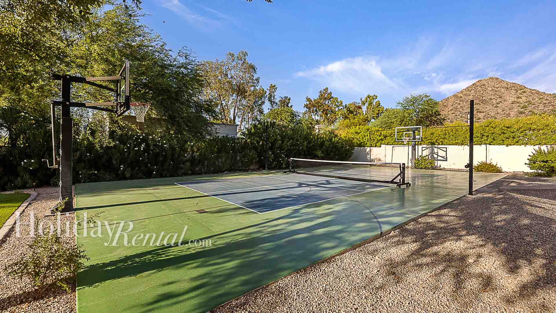 Amazing sports court designed for basketball and pickleball with mountain views.
