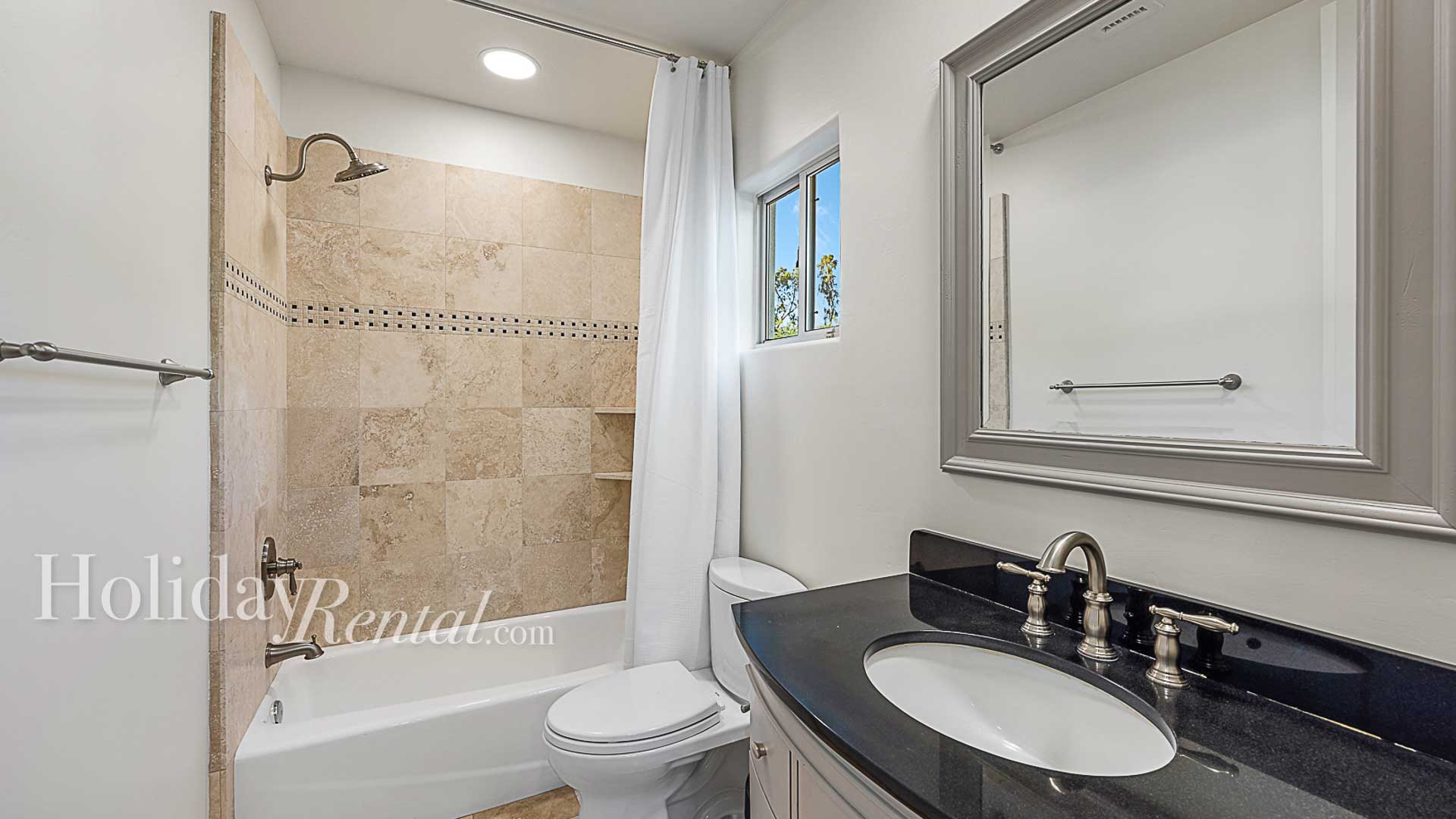 Bathroom 4 (En Suite to Bedroom 4) - Vanity with shower and tub combo.