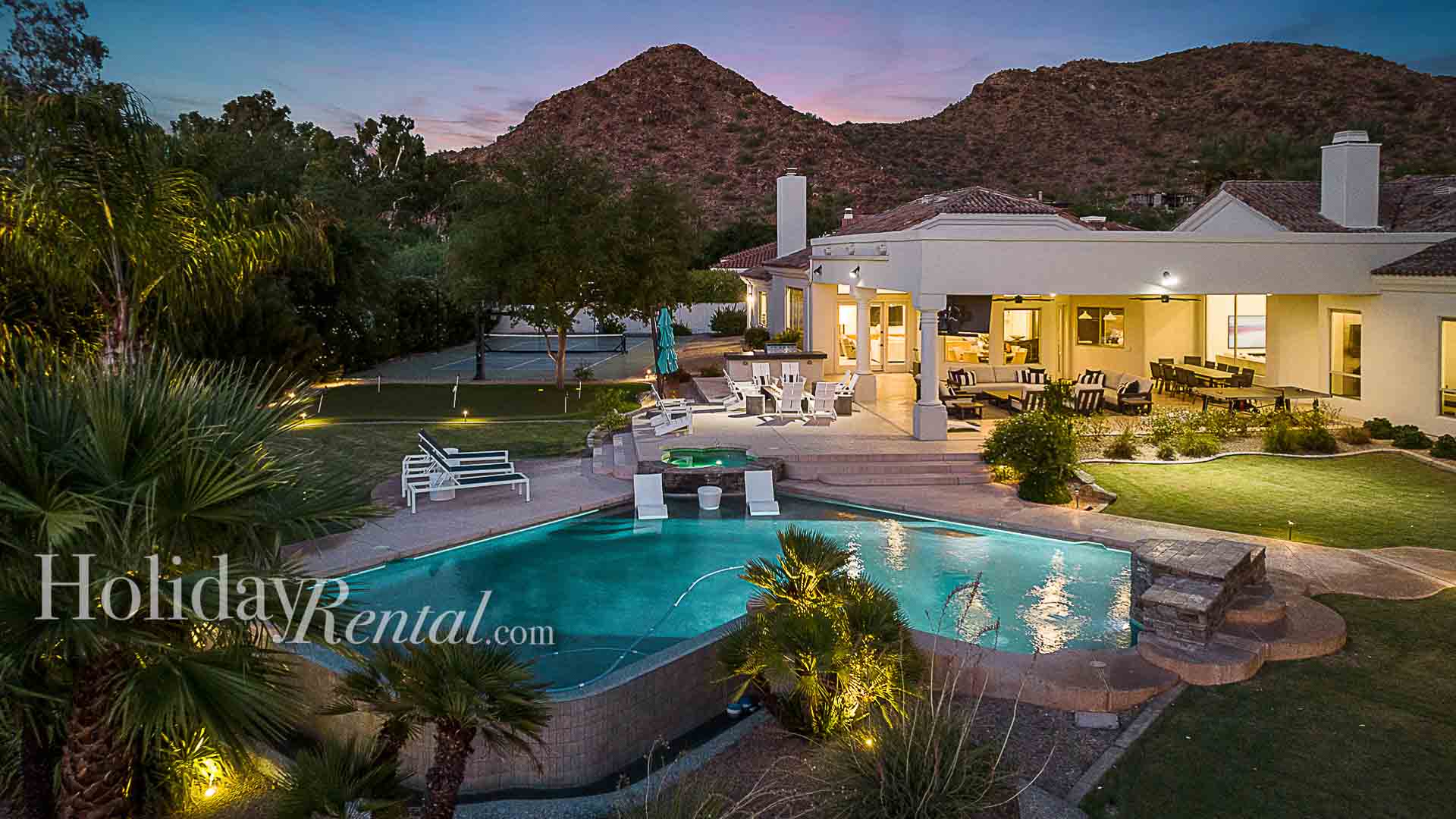 Backyard with tons of games and entertainment for everyone at sundown with mountain views.